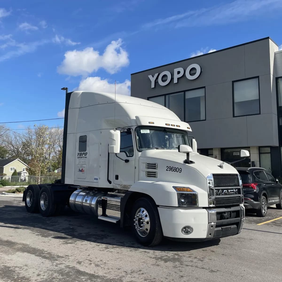Yopo Expedite truck parked outside the company office